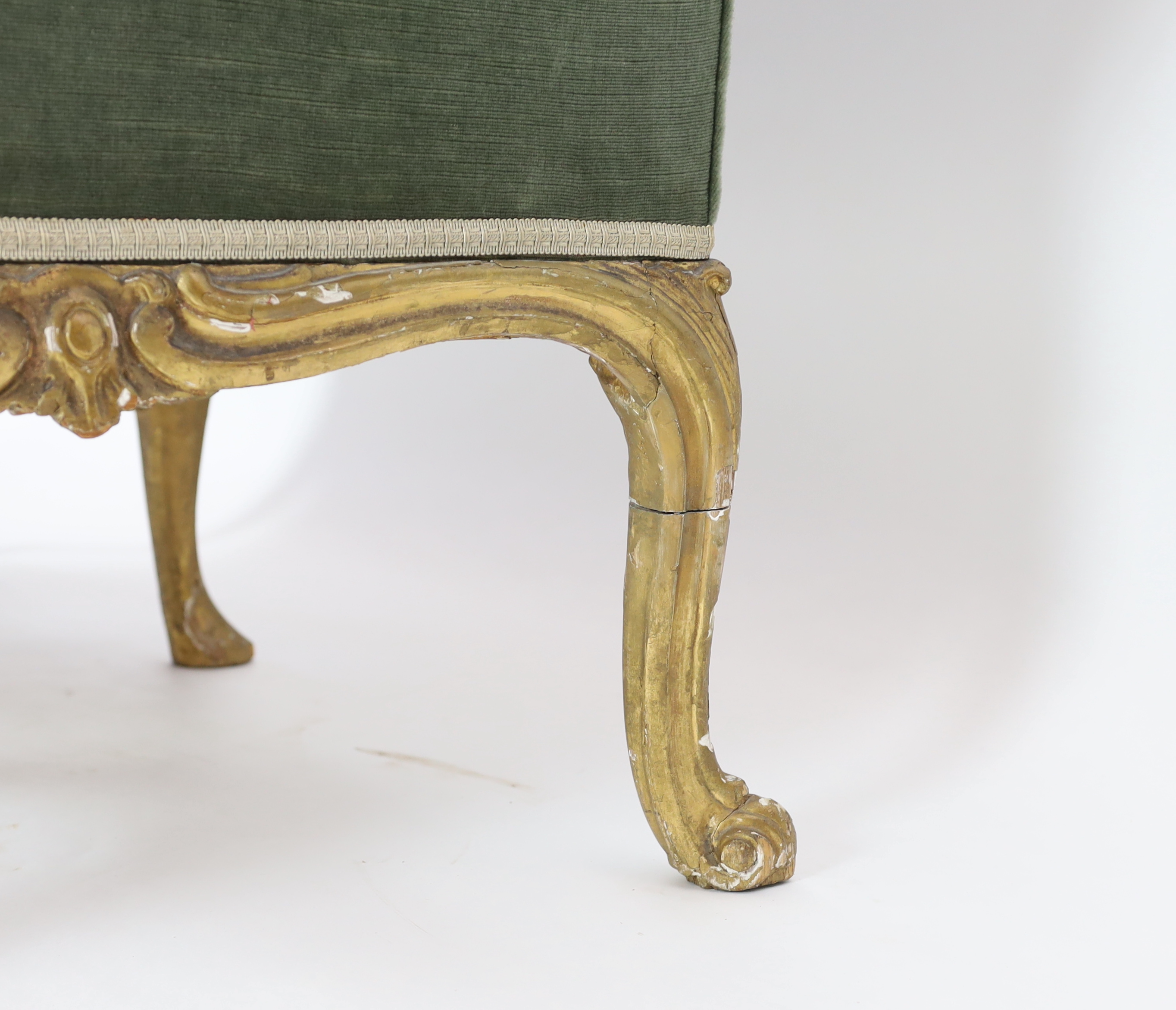 A mid 18th century Louis XV style giltwood settee 156cm wide, 82cm deep, 86cm high